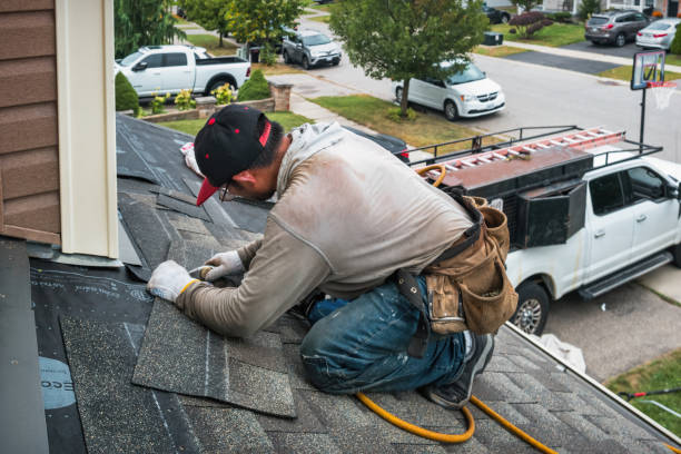 Professional Storm Damage Roof Repair technician working in Round Mountain, TX